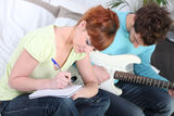 Youth writing a song Royalty Free Stock Images