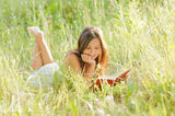 Woman read book in the park Stock Images