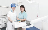 Miss dentist and patient Royalty Free Stock Photography