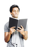Asian student studying from textbook Stock Photography
