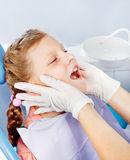Kid in dentist examination room Stock Photos