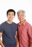 Studio Portrait Of Chinese Father With Adult Son Stock Photography