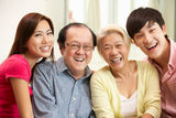 Chinese Parents With Adult Children Relaxing Royalty Free Stock Photography