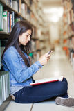 Hispanic student texting Stock Photo