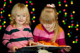 Two girls read book Stock Photography