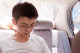Young man read in car Stock Image