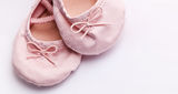 Little girlie baby shoes Stock Photos