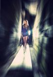 Sexy blond lady through the rocks Royalty Free Stock Photo