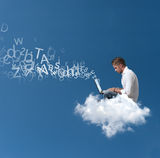 Businessman works over a cloud Stock Photo