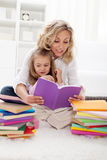 Picking a story to read with mom Stock Photography