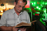 Scientist with glass read book in his lab Royalty Free Stock Photo