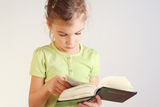 Little girl read bible Stock Images