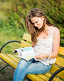 Woman read a magazine Stock Image