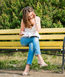 Woman read in park Stock Photo