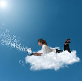 Businesswoman over a cloud Stock Photography