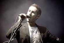 Robert del Naja performing with Massive Attack in Sydney, 2010.jpg