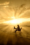 Amazing rays of light of woman study on beach Stock Photos