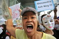 Anti government white mask protest in bangkok a protester shouts slogans while attending a rally s shopping district on june Stock Photo