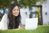 Asian Student Studying on Laptop Computer Royalty Free Stock Photos