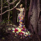 Beautiful lady in dress of flowers Stock Image
