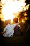 Boy and girl on sunset Stock Photography
