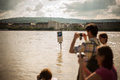 Budapest floods people watching the show of the swollen danube on its banks in Royalty Free Stock Images