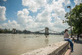 Budapest floods people watching the show of the swollen danube on its banks in Stock Photo