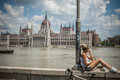 Budapest floods people watching the show of the swollen danube on its banks in Stock Photos
