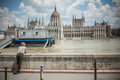 Budapest floods people watching the show of the swollen danube on its banks in Stock Images