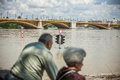 Budapest floods people watching the show of the swollen danube on its banks in Stock Images