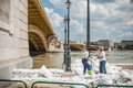 Budapest floods people watching the show of the swollen danube on its banks in Stock Images