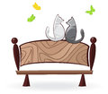 Cat on the bench cats sit a and look at butterflies Stock Photos