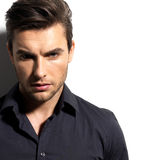 Fashion portrait of young man in black shirt Stock Image
