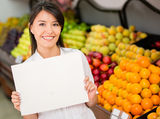 Female holding a banner at the supermarket Stock Photography