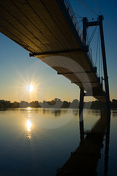 Suspension Bridge In Sunrise Stock Photo