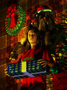 The krampus a young woman holds a gift as looms behind her Stock Photos