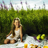 Little girl at picnic Stock Image