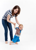 Mother teaching baby to walk Royalty Free Stock Photos