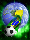 Soccer world cup ball surfing on a brazilian flag coming out of brazil on an earth globe Royalty Free Stock Photography