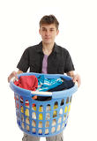 Teenager with laundry basket Stock Images