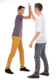 Teens giving high five Royalty Free Stock Photos