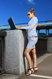 Woman in suit with laptop Royalty Free Stock Photos