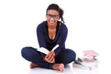Young African American student girl reading a book Stock Photography