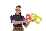 Young female teacher teaching alphabet smiling Royalty Free Stock Photos