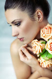 Young lady keeping roses Royalty Free Stock Photography